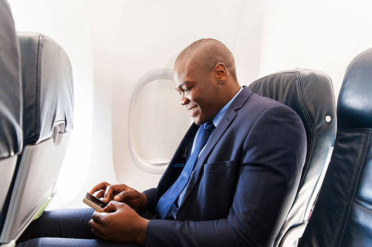 JETS man smiling in airplane